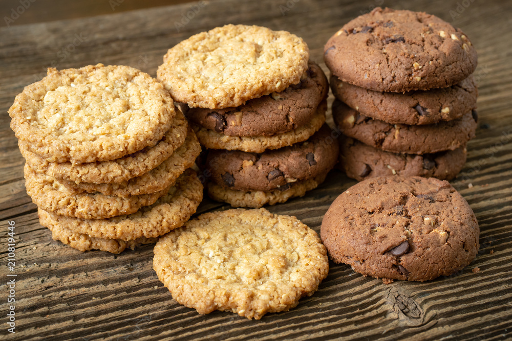 Various tasty cookies biscuits on wooden background Various tasty cookies biscuits on wooden background