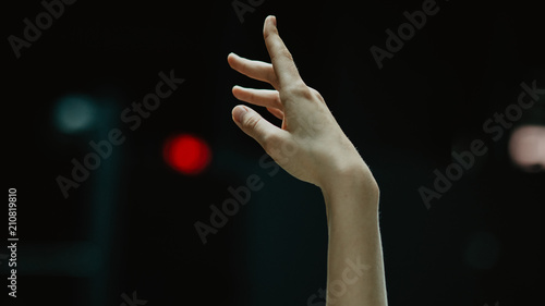 Close up of practice makes perfect- ballerina practices on the dancing hall. Image of ballerina hands in the action. 