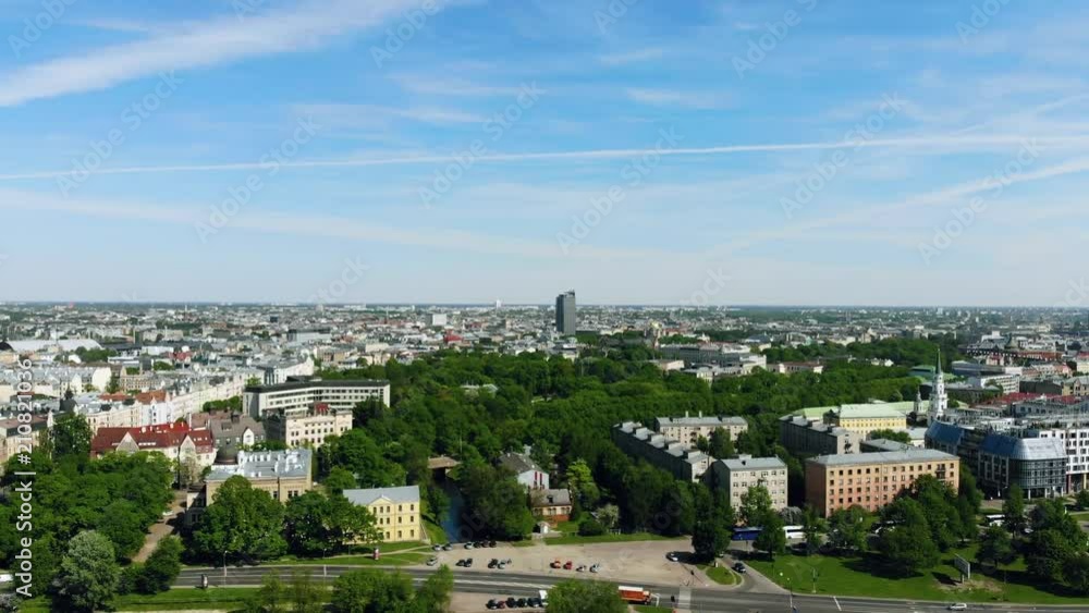 Aerial view flying over the capital city in Riga, Latvia. Trees and green environment in the city Aerial view flying over the capital city in Riga, Latvia. Trees and green environment in the city
