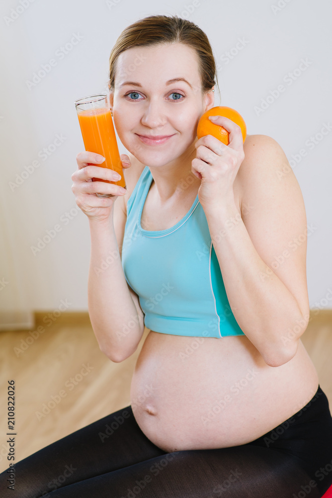 Yappy pregnant woman with orange juice Yappy pregnant woman with orange juice