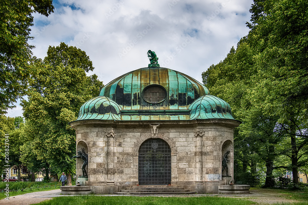 Munich, Germany - June 09, 2018: Hubertusbrunnen. Hubertusbrunnen is a fountain complex in the west of Munich. It is located at the eastern end of the Nymphenburger canal, north of the Grünwaldpark.