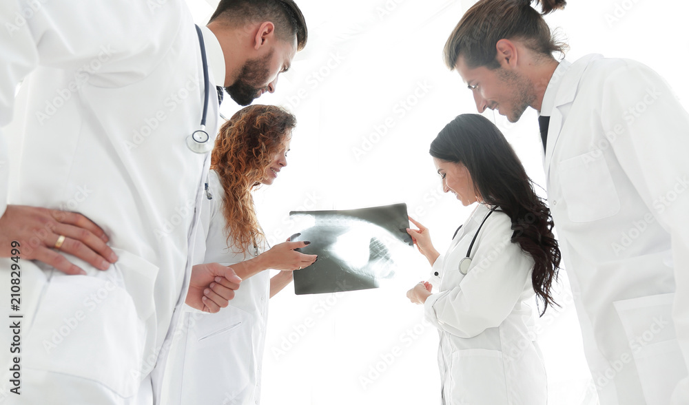 Fototapeta premium group of doctors discussing an x-ray