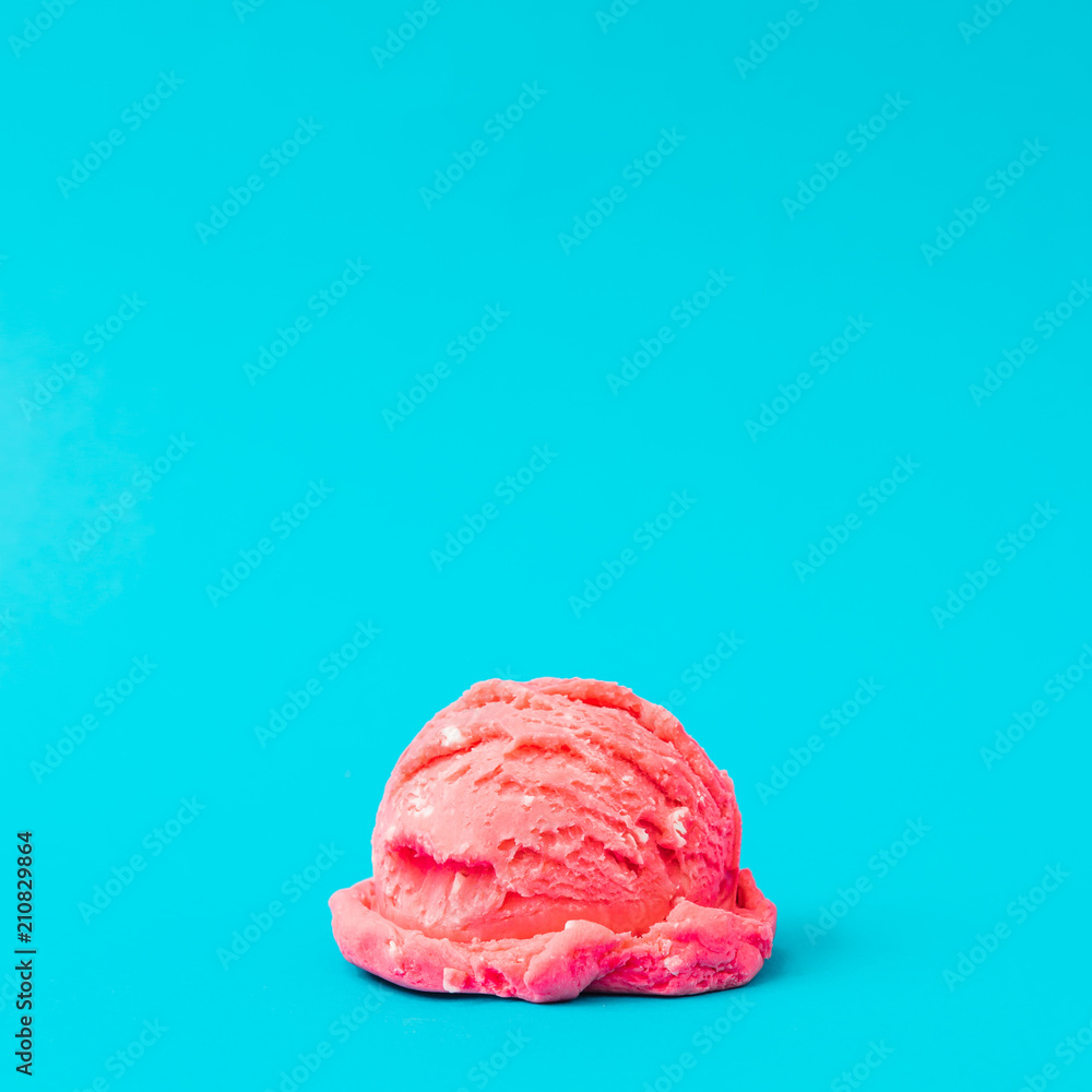 Obraz premium Pink strawberry ice cream on pastel blue background. Summer minimalism. Flat lay.