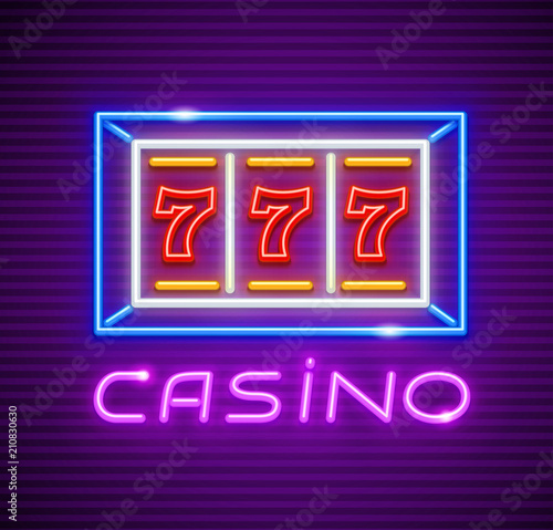 Casino playing slot-machine with jackpot 777 winning at screen.