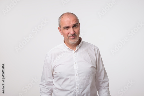 Portrait of mature sad man. He had bad mood. photo