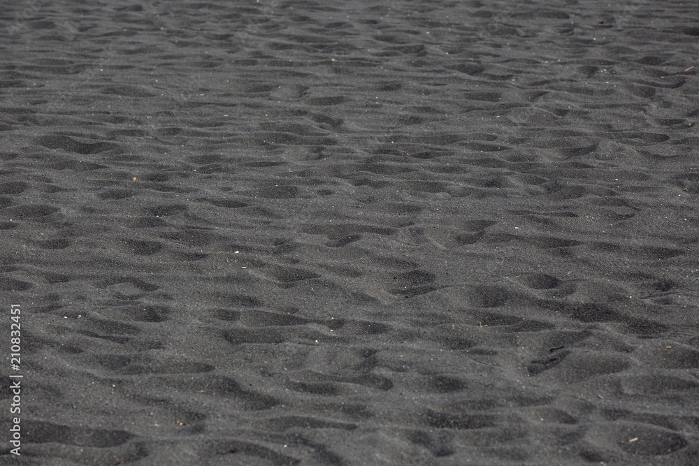 Black volcanic beach sand texture background Black volcanic beach sand texture background