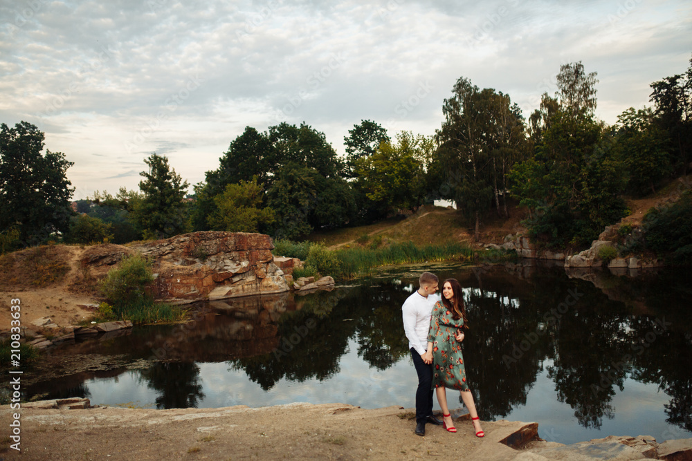 Couple in love celebrating anniversary on the rock