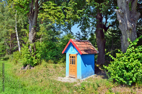 Blue small chapel in nature