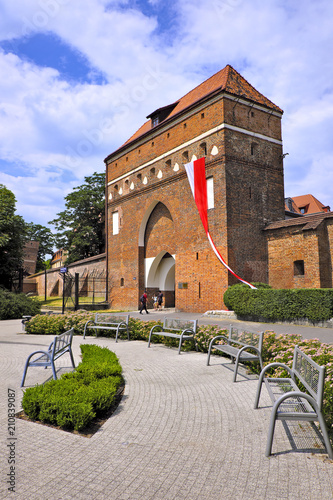 Torun, Poland - Historical Temple Gate of the Torun old town gothic defense walls by the Vistula river photo