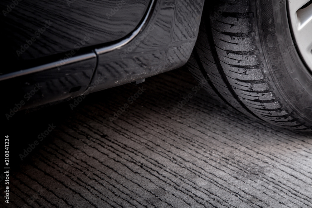 Tire wear concept. Danger of using old car bald tire with very little tread remaining. Tire wear concept. Danger of using old car bald tire with very little tread remaining.