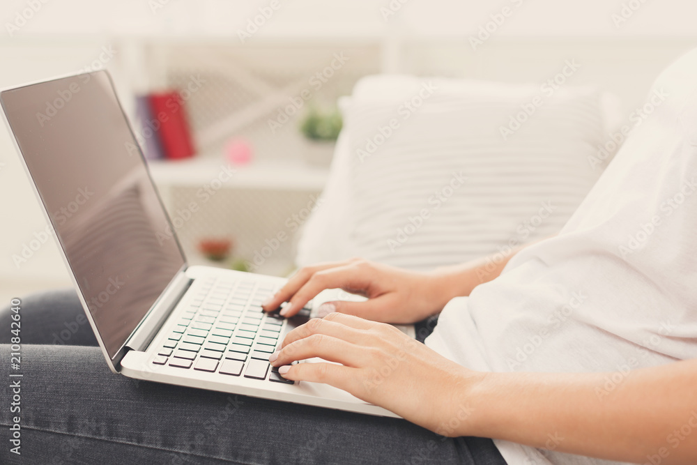 Unrecognizable woman typing on laptop, closeup Unrecognizable woman typing on laptop, closeup