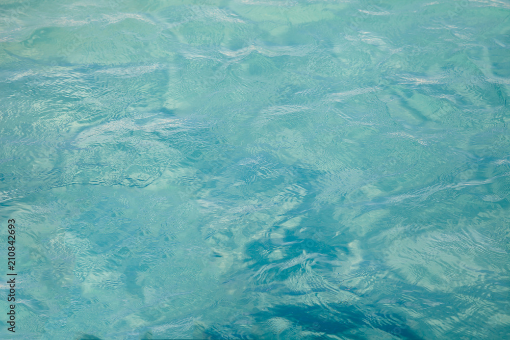 Blue sea ocean water background .Tropical Pattern blue ripple curl water in swimming pool . Blue sea ocean water background .Tropical Pattern blue ripple curl water in swimming pool .
