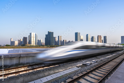 high speed train with city skyline