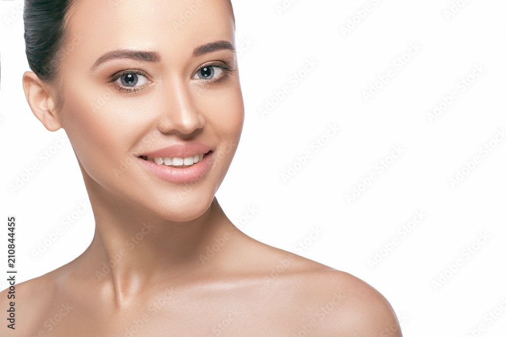 Studio shot of young smiling beautiful woman on white background. Portrait of women with perfectly clean and fresh skin, cosmetology and esthetic facial care Studio shot of young smiling beautiful woman on white background. Portrait of women with perfectly clean and fresh skin, cosmetology and esthetic facial care