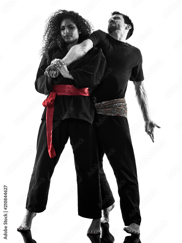 one caucasian woman practicing martial arts Kung Fu Pencak Silat in studio isolated on white background one caucasian woman practicing martial arts Kung Fu Pencak Silat in studio isolated on white background
