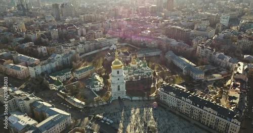 A bird's eye view, panoramic video from the drone in 4K to the Saint Sophia's Cathedral, Sofiyivska Square in the city of Kiev, Ukraine. People on the square on Easter days. photo