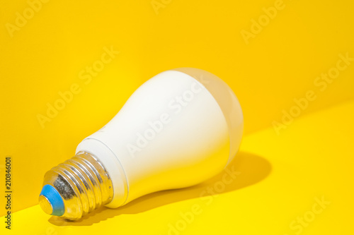 Light bulb on yellow background with copy space.Bright and fresh idea concept.