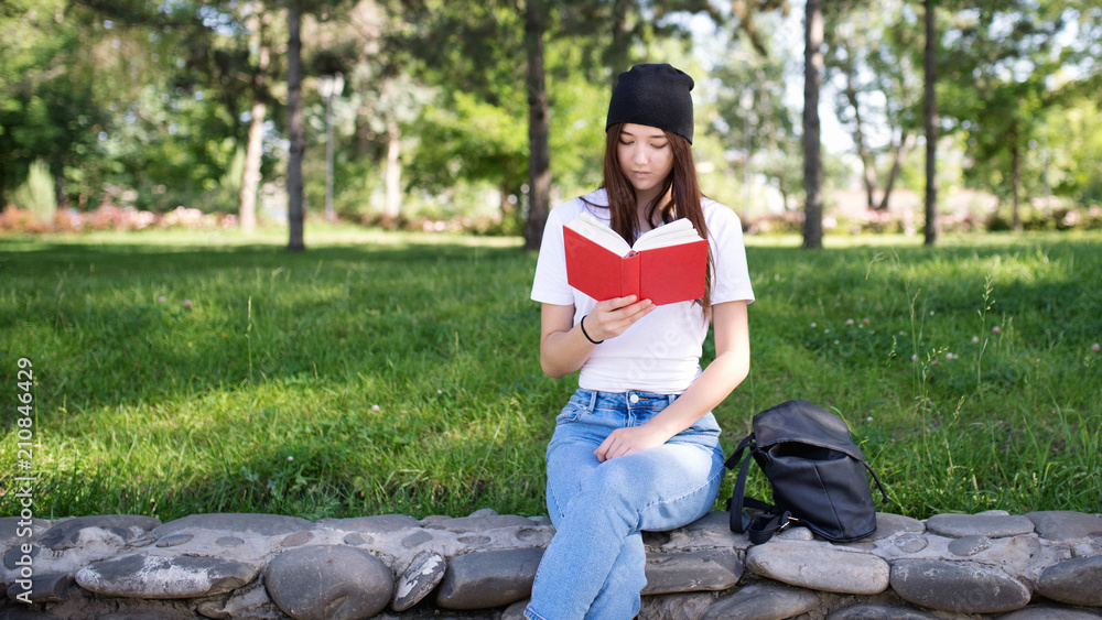 Student in the park reading a book Student in the park reading a book