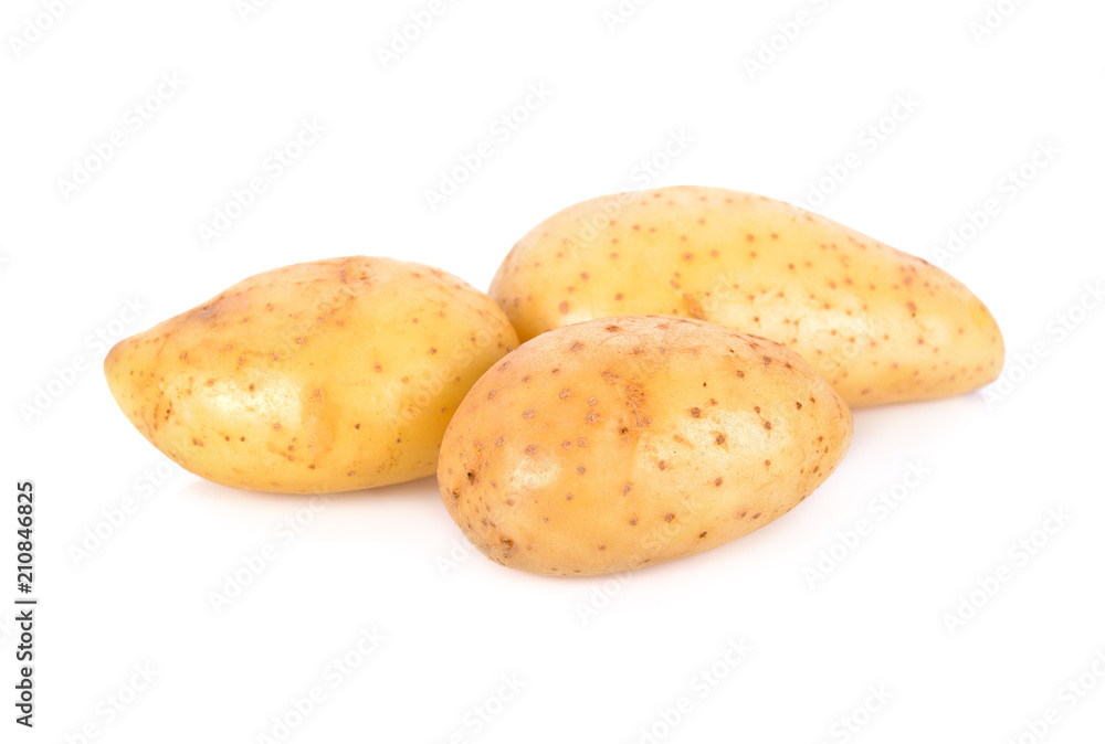 whole unpeeled fresh potatoes on white background whole unpeeled fresh potatoes on white background