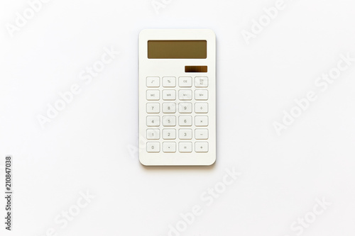 White powered solar calculator isolated on white background viewed from above in studio.
