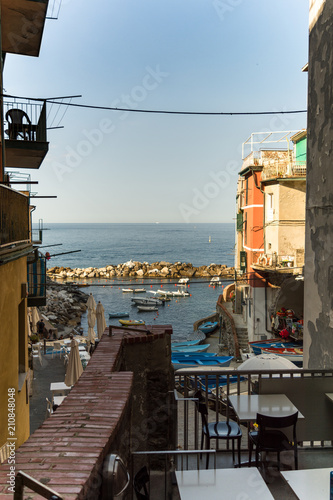 Vertical View of the Port of Riomaggiore on Blue Sky Background.