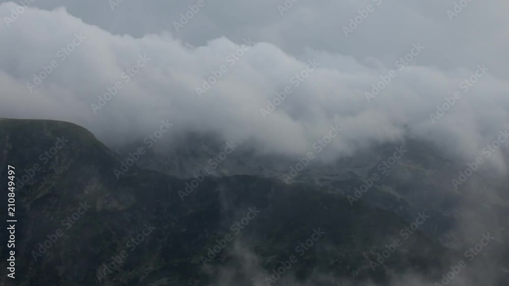 Time lapse of fast moving clouds up in the mountains. Heavy fog Time lapse of fast moving clouds up in the mountains. Heavy fog