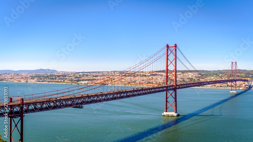 Ponte 25 de Abril. Most famous bridge in Portugal. Lisbon. Red bridge. Sunny day.