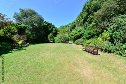 A rest area in  an English country garden in summertime.
 photo