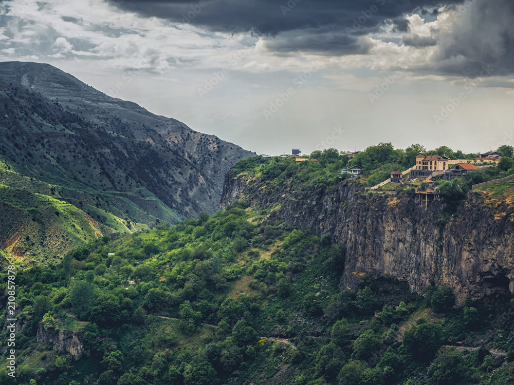 aerial view of beautiful mountains landscape with building over cliff on cloudy day, Armenia
