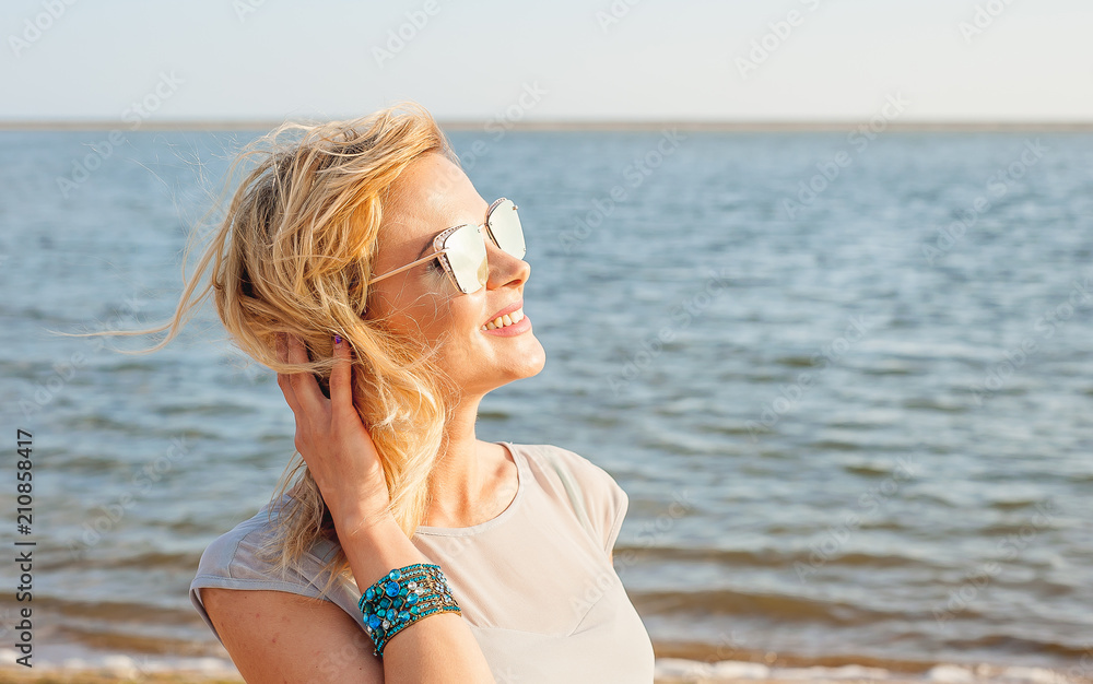 fashion photo of beautiful happy woman at sea. Beach travel. Summer fashion photo of beautiful happy woman at sea. Beach travel. Summer
