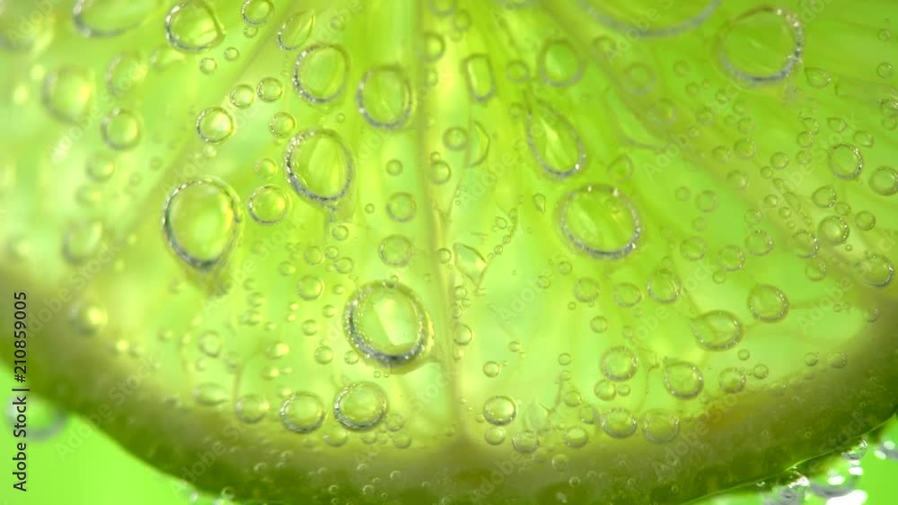 Lime. Slices of juicy lime. Mojito cocktail closeup. Slow motion 4K UHD video 3840x2160 Lime. Slices of juicy lime. Mojito cocktail closeup. Slow motion 4K UHD video 3840x2160