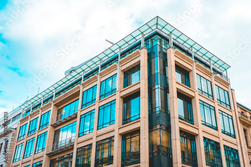 marble colored office building in the heart of berlin near unter den linden street with glass rooftop