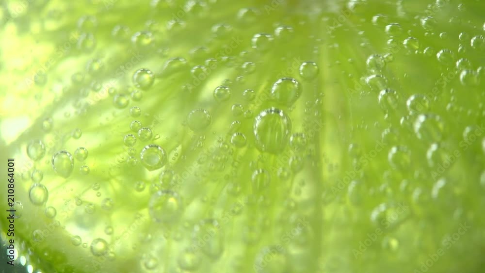 Lime. Slices of juicy lime. Mojito cocktail closeup. Slow motion 4K UHD video 3840x2160 Lime. Slices of juicy lime. Mojito cocktail closeup. Slow motion 4K UHD video 3840x2160