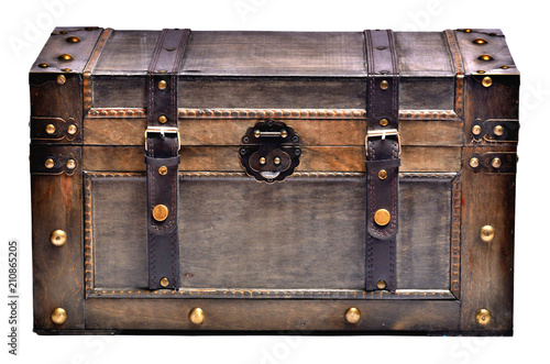 Old wooden chest with ornamental forging and leather straps isolated on white background