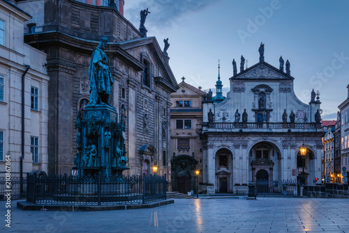 Krizovnicke square at the morning. Blue hour in Prague with illuminated city gas lamps and Charles IV statue, Czech Republic