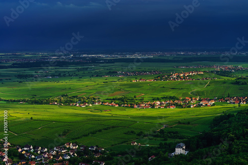 Thundery weather befor the storm over the green valley in Alsace, aerial view, vivid colors photo