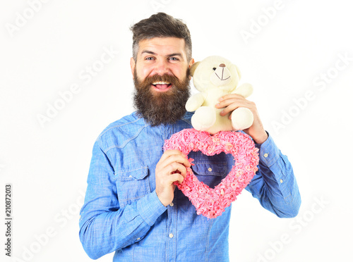 bearded macho man with pink valentines heart photo