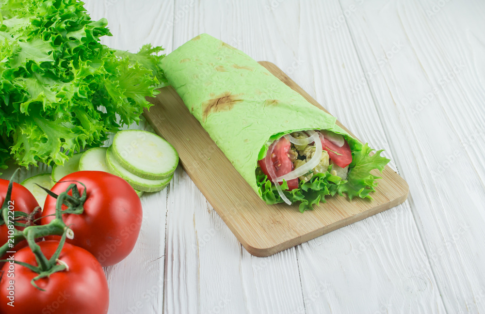 vegetarian shaverma from vegetables, on a wooden background vegetarian shaverma from vegetables, on a wooden background