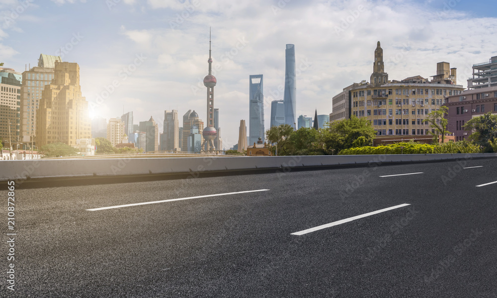 Obraz premium Air highway asphalt road and office building of commercial building in modern city