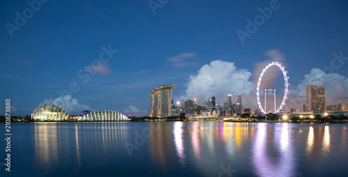 Sun rising over the downtown skyline of Singapore as viewed from across the water from The Garden East. Singapore.