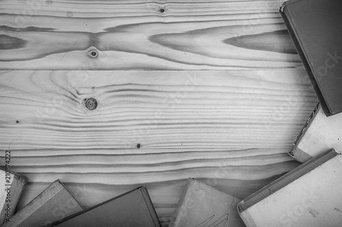 Old books on a wooden table.