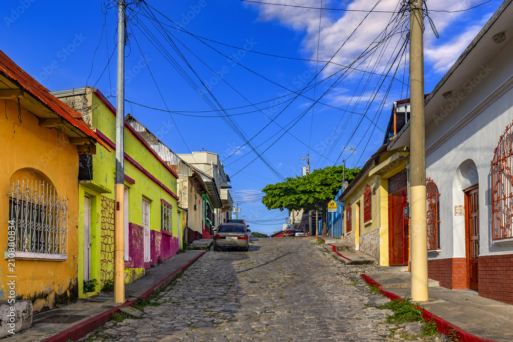Guatemala. Flores, El Peten. The old part of the city in colonial style with narrow cobblestone streets, red-roofed buildings and pastel houses