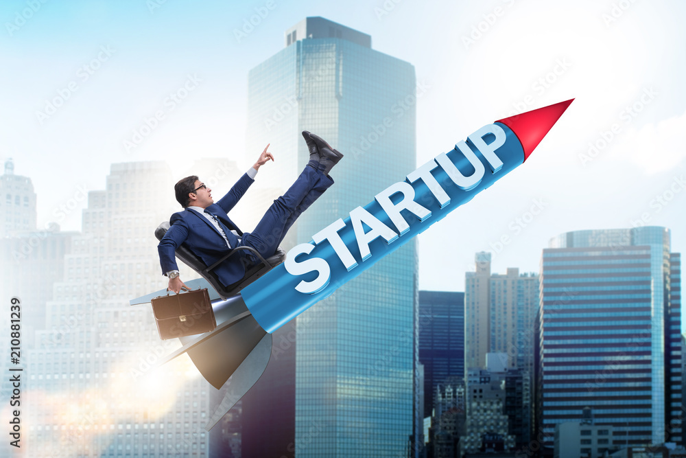 Businessman in start-up concept flying on rocket Businessman in start-up concept flying on rocket