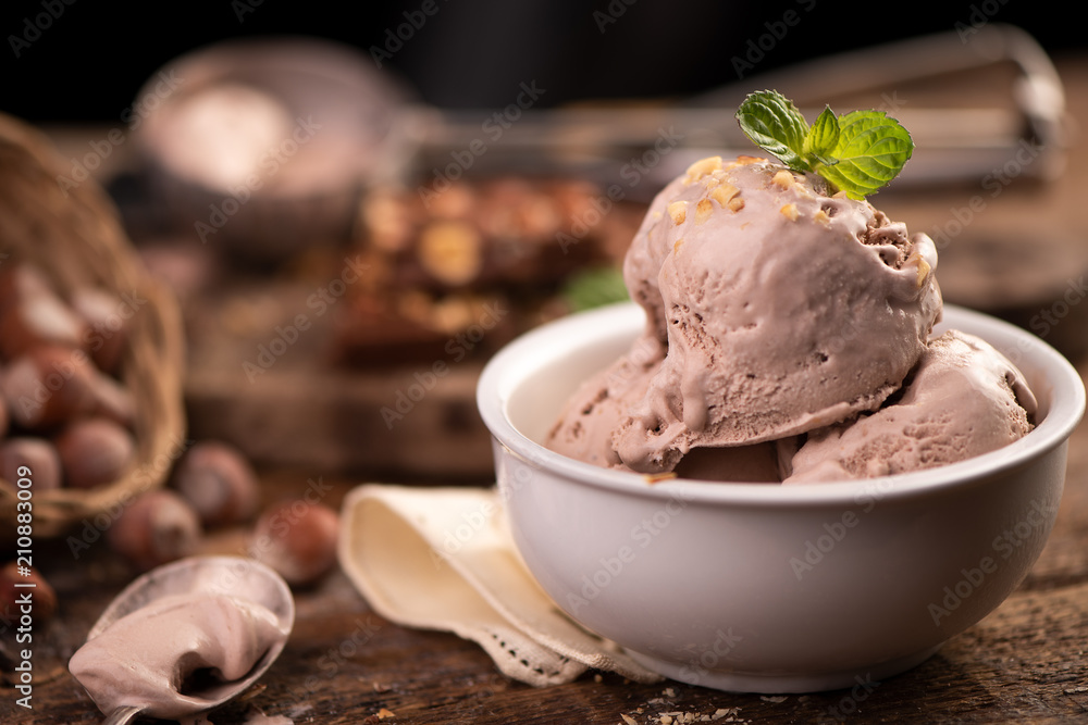 Fresh hazelnut ice cream on wooden table. Fresh hazelnut ice cream on wooden table.