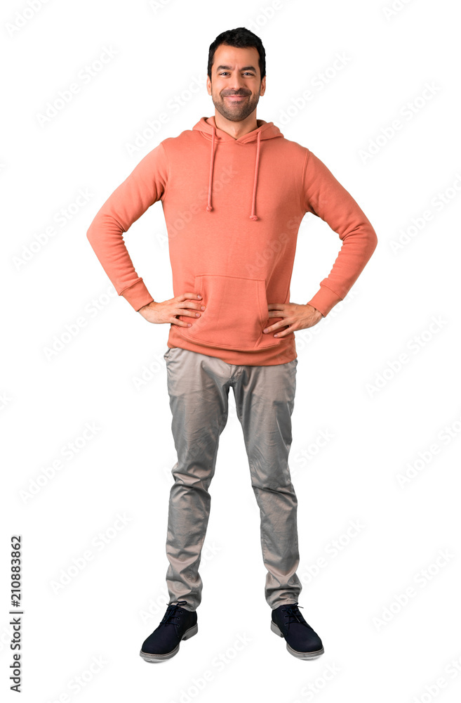 Full body of Man in a pink sweatshirt posing with arms at hip on isolated white background Full body of Man in a pink sweatshirt posing with arms at hip on isolated white background