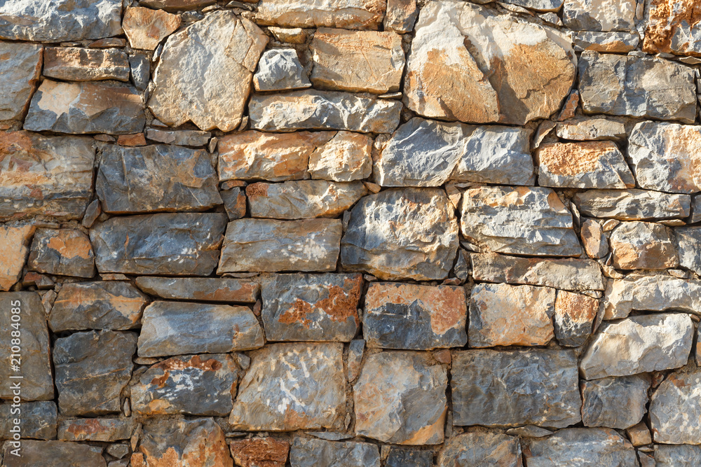 Photo of a plain stone wall for background Photo of a plain stone wall for background