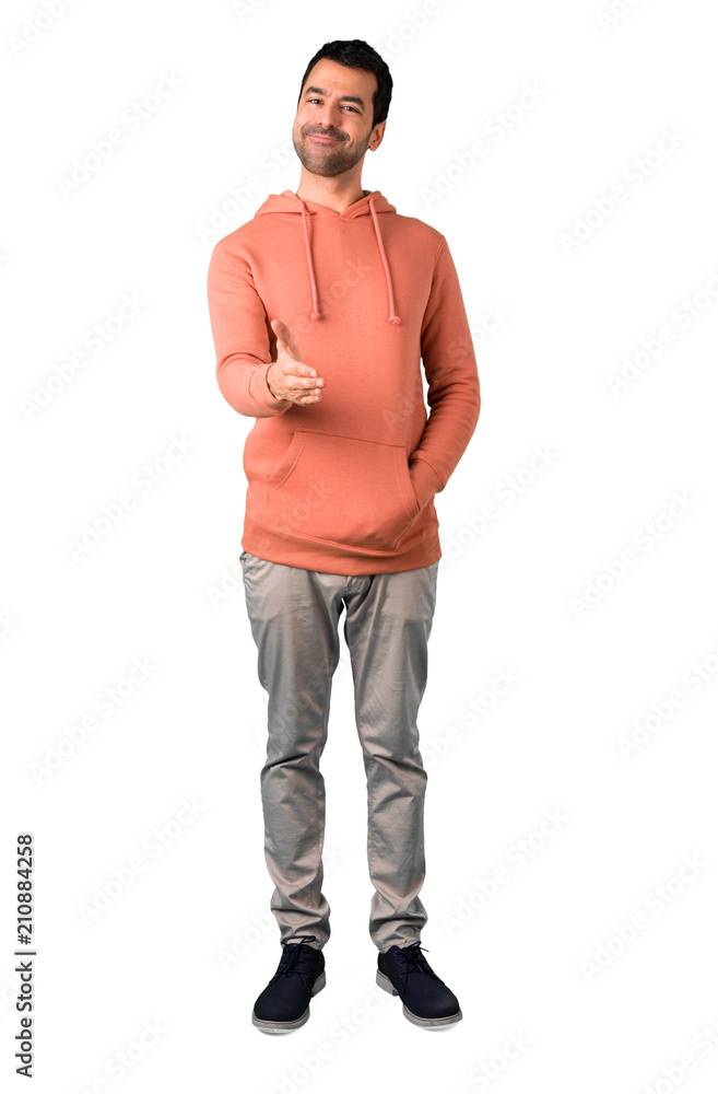 Fototapeta premium Full body of Man in a pink sweatshirt shaking hands for closing a good deal on isolated white background