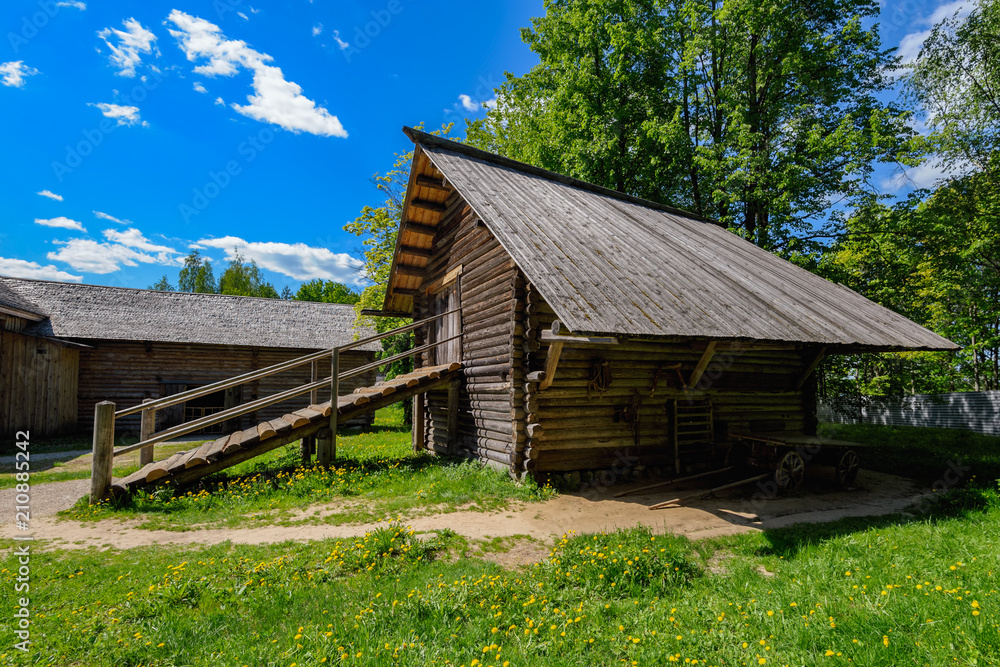 Ancient wooden log horse barn.