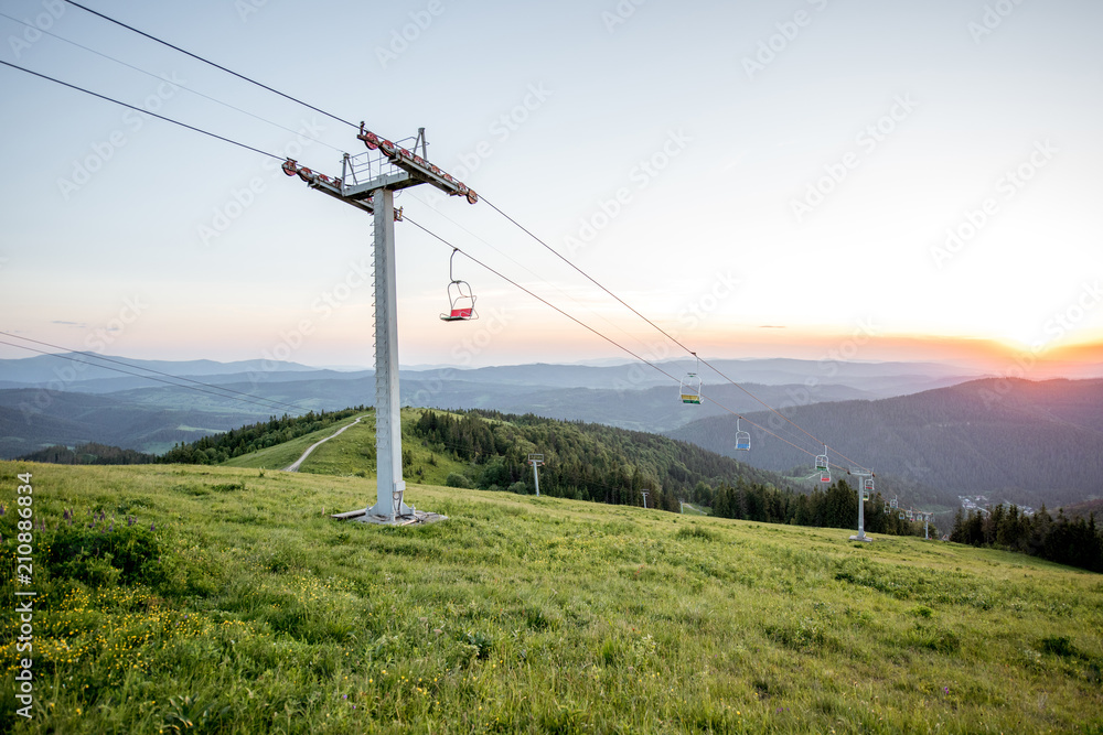 Landscape view on the beautiful Carpathian mountains with horeses and ski lift on the High Top near the Slavske village in Ukraine Landscape view on the beautiful Carpathian mountains with horeses and ski lift on the High Top near the Slavske village in Ukraine