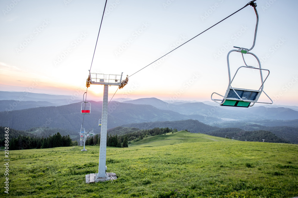 Landscape view on the beautiful Carpathian mountains with horeses and ski lift on the High Top near the Slavske village in Ukraine